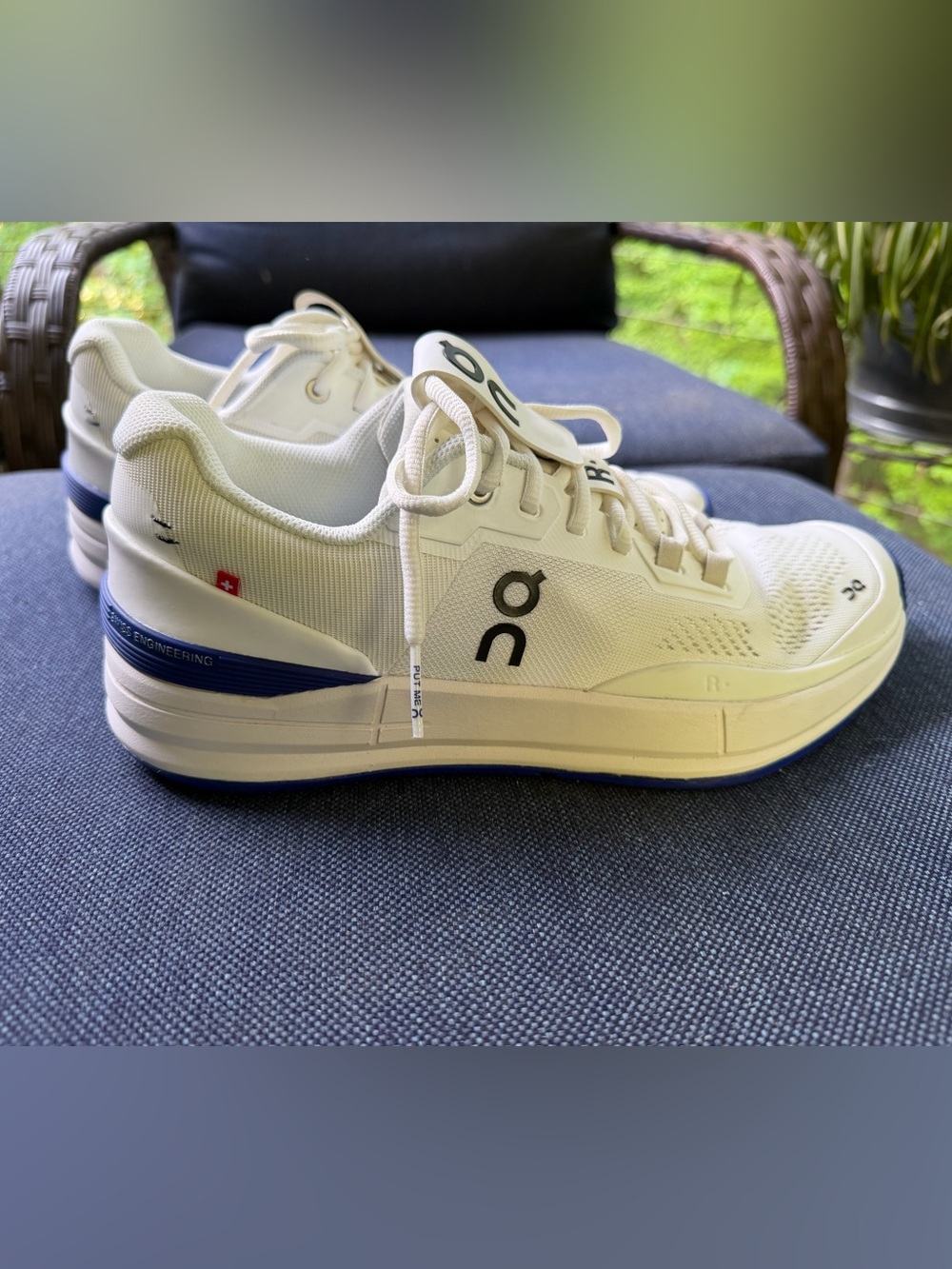 On Running White Athletic Sneakers with Blue Accents - Women